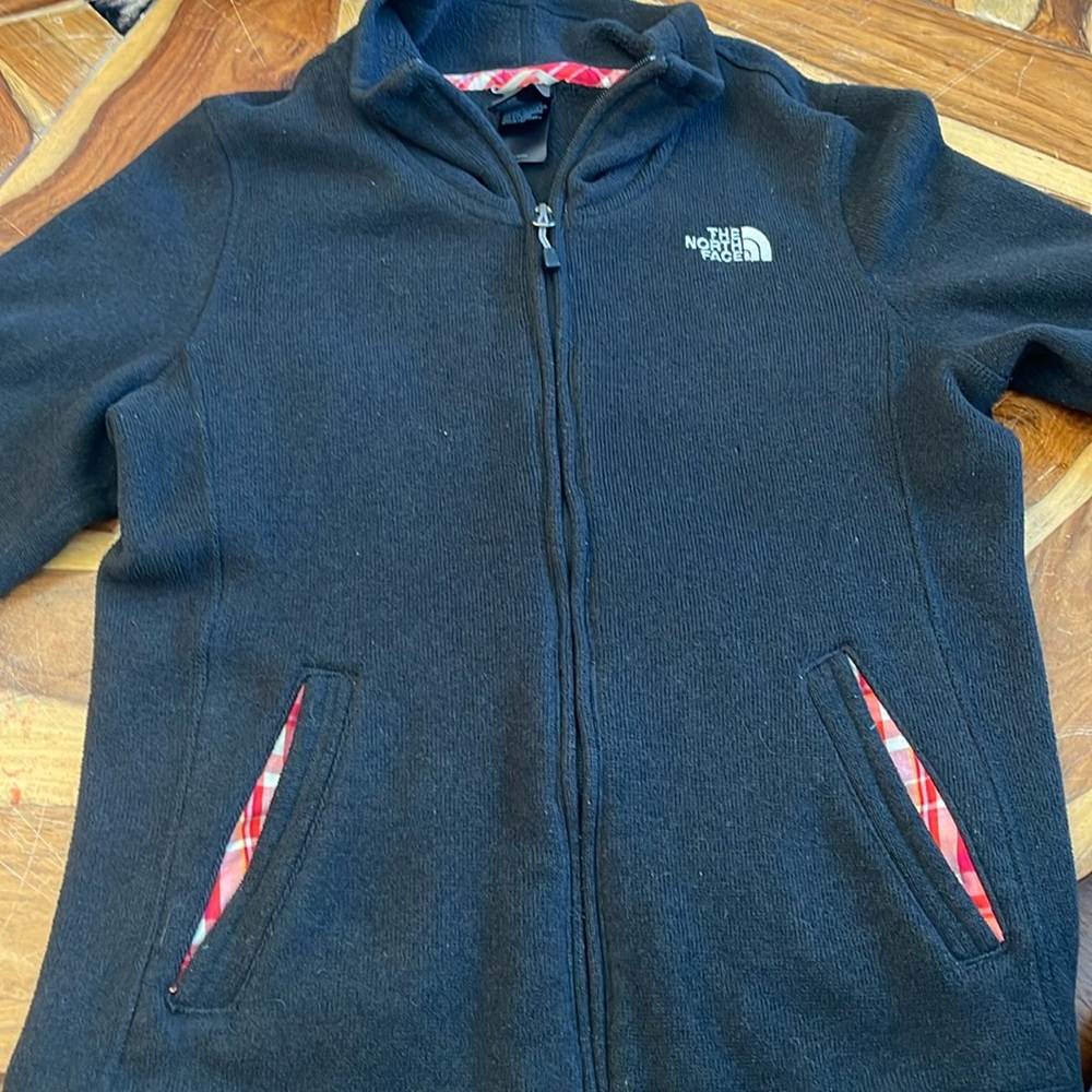 Gently used, Woman’s Black North Face Zip Up Sweater fleece Jacket size Large